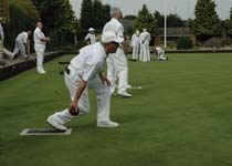 Person bowling on the mat